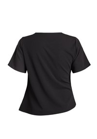 Czarna koszula z krótkim rękawem i okrągłym dekoltem, widoczna od tyłu, z lekko rozkloszowanym dołem.