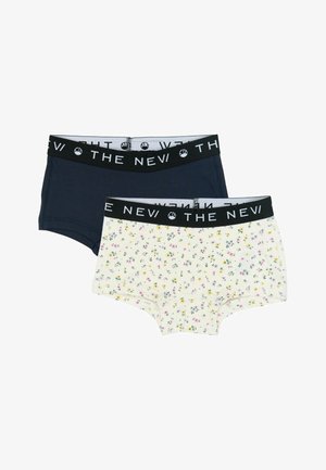 To par bomuldsshorts: et i marineblå og et i creme med blomsterprint. Begge har sorte elastiske linninger med "THE NEW" logo.