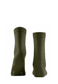 Chaussettes vert olive avec des bords ribbed, présentant des motifs à pois texturés et une texture lisse. Talon et orteils renforcés pour plus de durabilité.