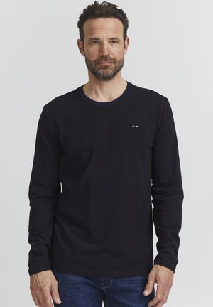 Long-sleeve navy T-shirt with a round neck, made from cotton, featuring a small multi-colored logo on the chest. Simple design and fit.