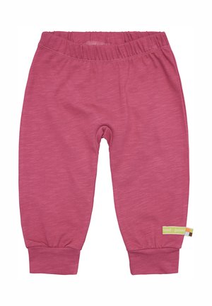 Rosa Baumwollhose mit weichem Stoff, elastischem Bund und gerippten Bündchen. Verfügt über ein kleines grünes Etikett mit "loud + proud" an der Seite.