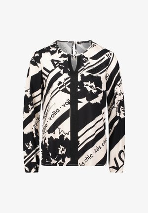 Czarna i kremowa bluzka z abstrakcyjnymi kwiatowymi wzorami oraz napisem, z okrągłym dekoltem, długimi rękawami i centralnym szwem.