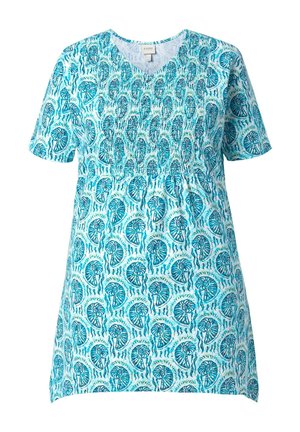Niebiesko-biała tunika z krótkim rękawem, dekoltem w serek i wzorem wirujących muszli, z marszczonym detalem na piersi.