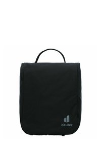 Bolsa de aseo de viaje rectangular y negra con un asa superior, que presenta un diseño elegante, cierre de cremallera y un pequeño logo en la esquina inferior.