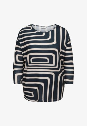 Zwart-witte blouse met lange mouwen, voorzien van een abstract geometrisch doolhofpatroon en een ronde hals.