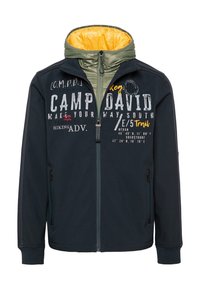 Marineblaues Jackett mit Reißverschluss, grün- und gelbgesäumter Kapuze und bedrucktem Text auf der Vorderseite. Verfügt über zwei seitliche Taschen und gerippte Bündchen.