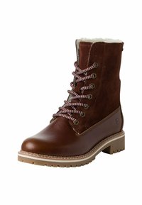 Bruine leren en suède enkelboots met witte fauxbont voering, bruin- en witgestreepte veters, ronde neus en een platte rubberen zool.
