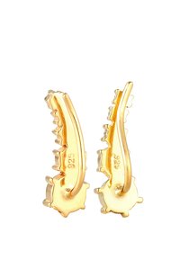 Boucles d'oreilles en ton or avec un motif ondulé, présentant une surface texturée. Marquées "925" pour l'argent sterling.