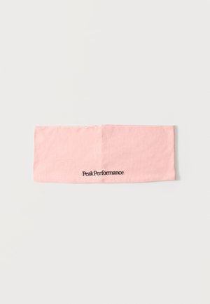 Svetloružová látková čelenka s nápisom "Peak Performance" vytlačeným čiernou farbou uprostred na prednej strane.