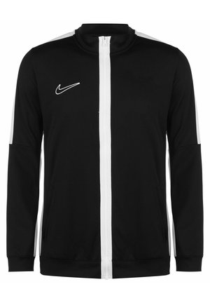 Schwarze Nike-Zipjacke mit weißen vertikalen Streifen an Ärmeln und Reißverschluss, mit dem Nike-Swoosh-Logo auf der linken Brust.