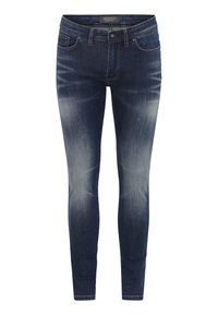 Jeans ajustados en denim azul oscuro con un lavado desteñido. Cuenta con cinco bolsillos y herrajes metálicos. Textura suave con un ligero stretch.