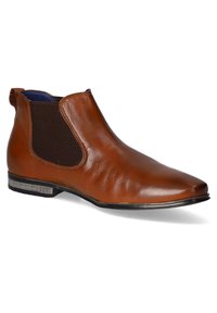 Botte Chelsea en cuir marron avec panneaux latéraux élastiques, petit talon et languette à tirer à l'arrière, présentée sur fond blanc.