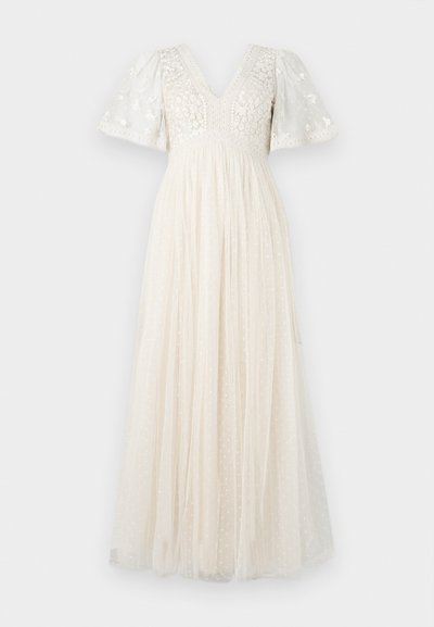 Maxi dress in cream with a V-neck, puff sleeves, and floral embroidery. The skirt features sheer layers with polka dots for added texture.