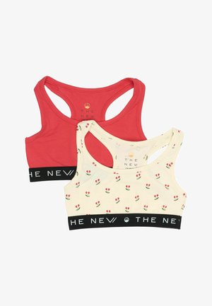 Dos bralettes: una roja sólido y la otra de color crema con un patrón floral. Ambas tienen tirantes anchos y una banda negra con el logotipo "THE NEW".