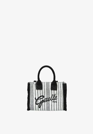 Borsa a righe bianche e nere con manici neri e "Gaelle Paris" ricamato sul davanti, con dettagli a frange ai lati.