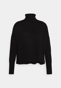 Svart polotröja i mjukt stickat material, med en kort silhuett, långa ärmar och ribbade detaljer vid halsen och nederkanten.