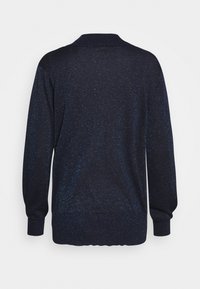 Gilet bleu marine avec une finition texturée et pailletée. Présente un col rond, des manches longues et des bords côtelés au niveau des poignets et de l'ourlet.