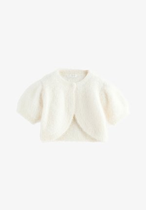 Bela puhasta kratka jopica z kratkimi napihnjenimi rokavi in enim gumbom za zapenjanje pri izrezu na vratu.