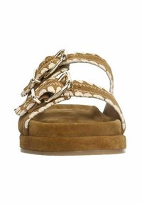 Brown suede sandals featuring two braided straps with silver buckles. Cushioned footbed and flat sole for comfort.