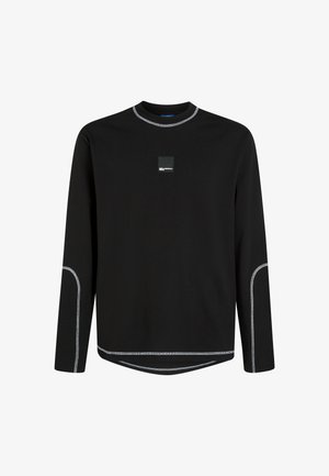 Must have musta varrukatega T-särk puuvillast, ümar kaelus, kontrastsete valgete õmblustega ja väikese ruudukujulise logoga rindkerel.