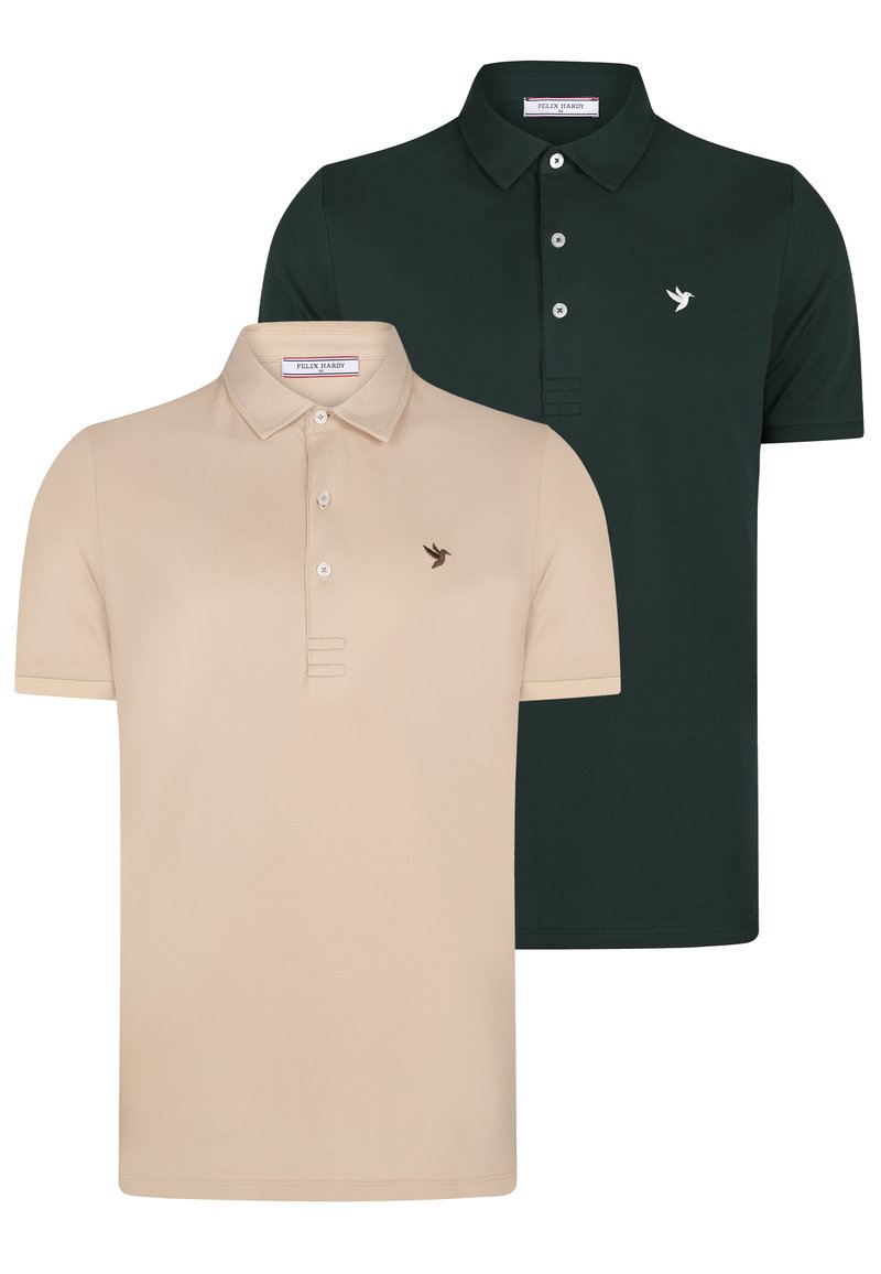 Deux polos : l'un beige avec un petit logo d'oiseau et trois boutons, l'autre vert foncé avec un logo similaire et deux boutons, tous deux à manches courtes.