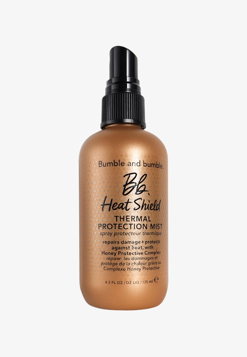 Bumble en bumble Heat Shield Thermal Protection Mist, bronzen fles met textuurpunten, zwarte spraymond, 125 ml, gelabeld met productdetails.
