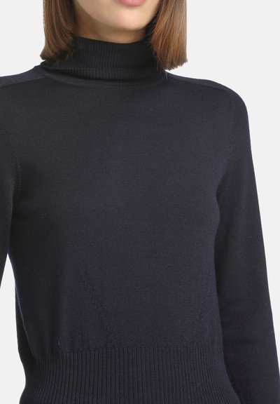 Navy-Turtleneck-Pullover aus weichem Netzmaterial, mit geripptem Kragen und Saum, figurbetontem Design und langen Ärmeln.