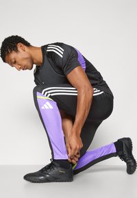 adidas Performance SQUADRA25 TRAINING PANT - Trainingsbroek - black/purple rush