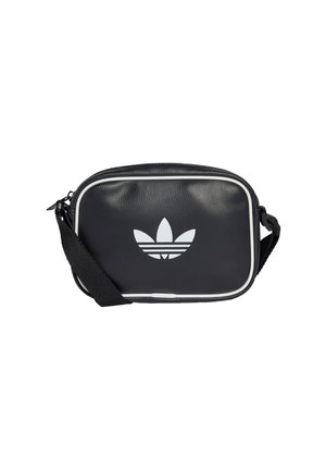 Sac bandoulière rectangulaire noir avec bord blanc et logo trefoil Adidas à l'avant, sangle noire réglable sur fond blanc.