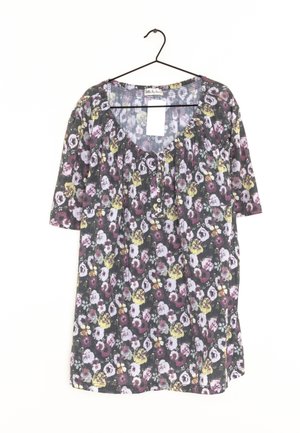 Floral tunic dress with short sleeves, black background, multicolor flowers, round neckline, and button detailing at the front.
