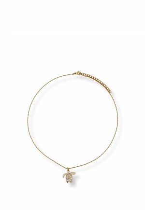 Delicate gold chain necklace with a small sea turtle pendant adorned with white crystals.