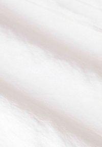 Smooth, lightweight, white fabric with a subtle sheen and soft texture, displaying slight folds across the surface.