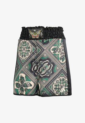Boxer shorts with elastic waistband, featuring a green, black, and cream geometric butterfly and floral pattern with a butterfly patch.