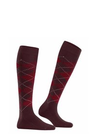 Calze fino al ginocchio con un motivo argyle in bordeaux e rosso scuro con dettagli bianchi, realizzate in un tessuto a coste per una maggiore texture.