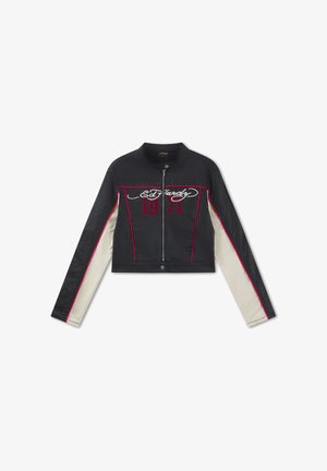 Black cropped jacket with front zipper, red piping, white panels on sleeves, and red "1971" with white "Ed Hardy" text on chest.