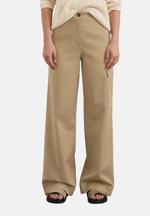 Beige wide-leg cargo pants made of durable fabric, featuring a front button closure, side pockets, and a relaxed fit.