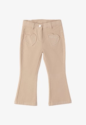 Pantalones de pana beige con perneras acampanadas y bolsillos delanteros en forma de corazón, presentan un botón y trabillas en la cintura.