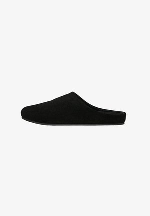 Black slip-on indoor slipper with closed toe and low heel, made of soft fabric for comfort.
