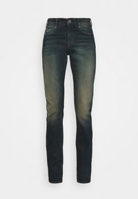 Mörkblå denimjeans med rak passform, subtilt blekna mot botten, femfickorsdesign och metallknappstängning.