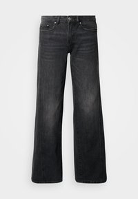 Sötétszürke farmer anyagból készült bőszárú farmernadrág, klasszikus ötlábos zsebes kialakítással, enyhe kifakítással és fém részletekkel az derékrészen.