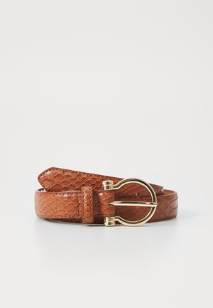 Brown leather belt with textured pattern and a gold rounded buckle, coiled on a white surface.