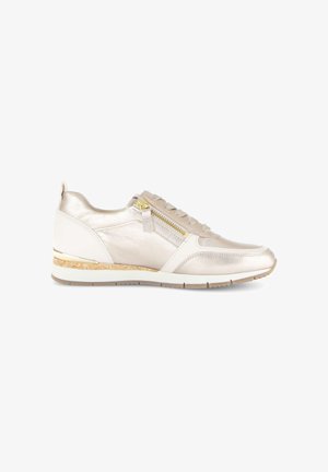 Beige and white low-top sneaker with side zipper, lace-up front, cork and rubber sole, and metallic gold detailing on heel.