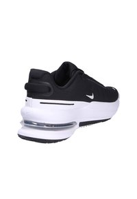 Sneaker Nike neri con intersuola bianca ammortizzata, tasca d'aria trasparente, materiale superiore liscio e dettaglio testurizzato sul tallone.