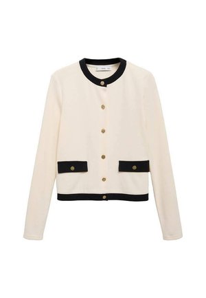 Cropped, cream jacket featuring a black collar and cuffs, decorative golden buttons, and two black pockets with button accents.