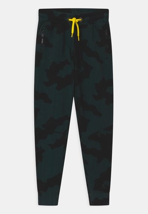Pantaloni joggers con motivo camouflage in nero e teal, dotati di un laccio giallo, due tasche con zip e una vestibilità aderente. Realizzati in tessuto elasticizzato.