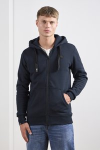 Marinefarvet zip-up hættetrøje lavet af bomuldsblanding, med snoretræk i hætten, foran lommer, ribbede manchetter og et lille logo på brystet.