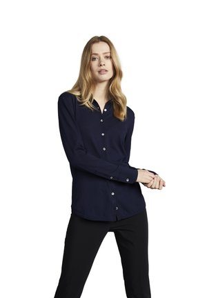 Navy blue long-sleeve button-up shirt with a collar, featuring a curved hem and cuffs, made from a smooth fabric.