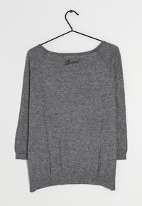 Gray long-sleeve sweater with a wide neckline, made from a textured fabric. Features a slightly curved hem and raglan sleeves.