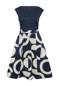 Navyblaues Kleid mit tailliertem Oberteil und ausgestellt Rock, der mit einem cremefarbenen kreisförmigen Muster verziert ist. Mit kurzen Ärmeln und einem verdeckten Reißverschluss im Rücken.