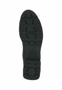 Suela de zapato de goma negra con un patrón texturizado y de relieve. Presenta ranuras y crestas hexagonales para facilitar el agarre y la tracción.
